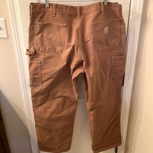Carhartt double knee loose fit rigid duck canvas pants.